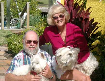 Rick and Sandra (Schneider) Burkhart and dogs, Hagar the Horrible and Captain Jack Sparrow, in Palm City.